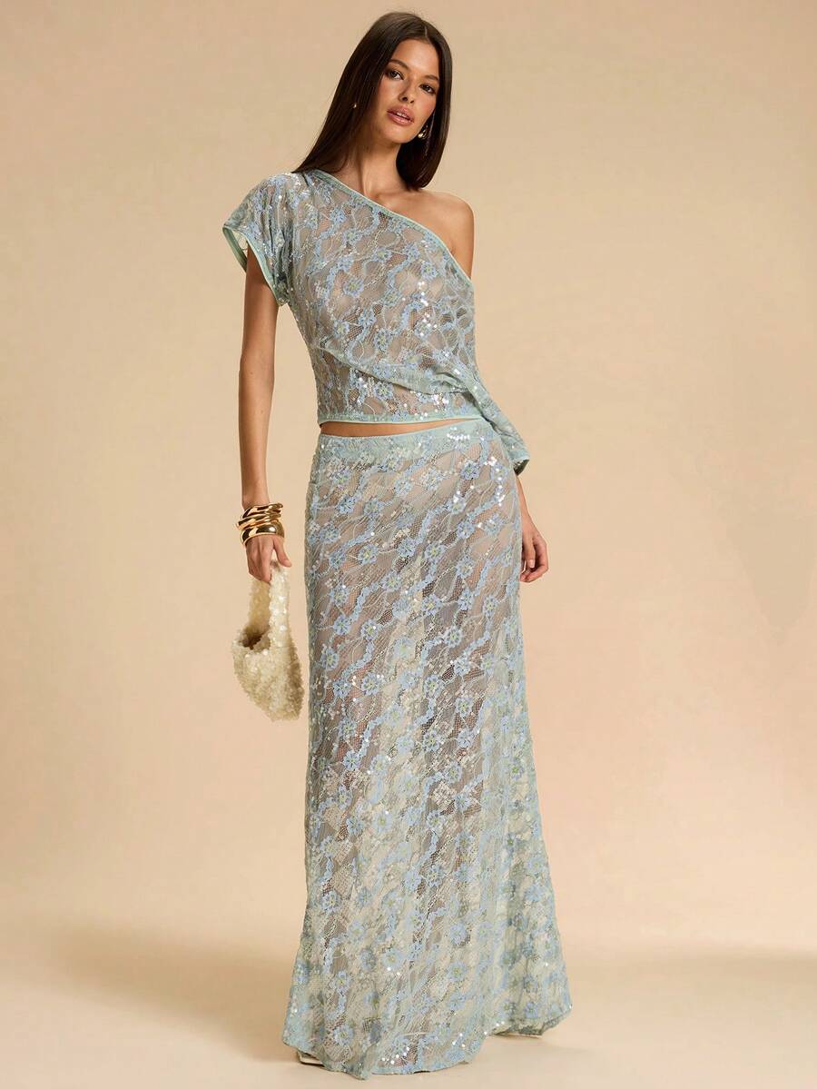 Black low waist extra long mermaid maxi skirt with asymmetrical zipper detail and side slit.