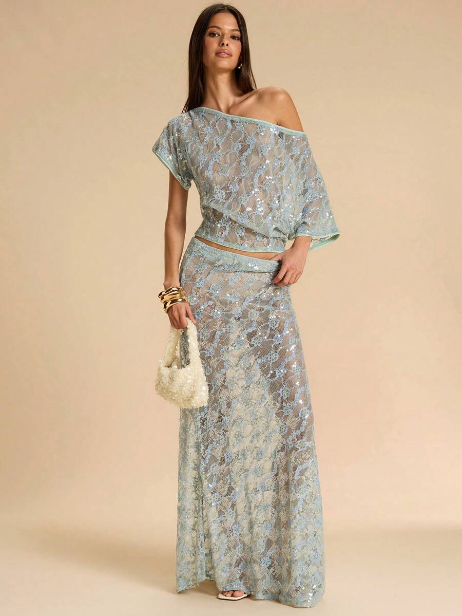 Black low waist extra long mermaid maxi skirt with asymmetrical zipper detail and side slit.
