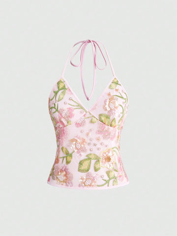 Women's floral embroidery backless halter crop top featuring contrast lace, ruched detailing, and slim fit in knitted pink fabric.