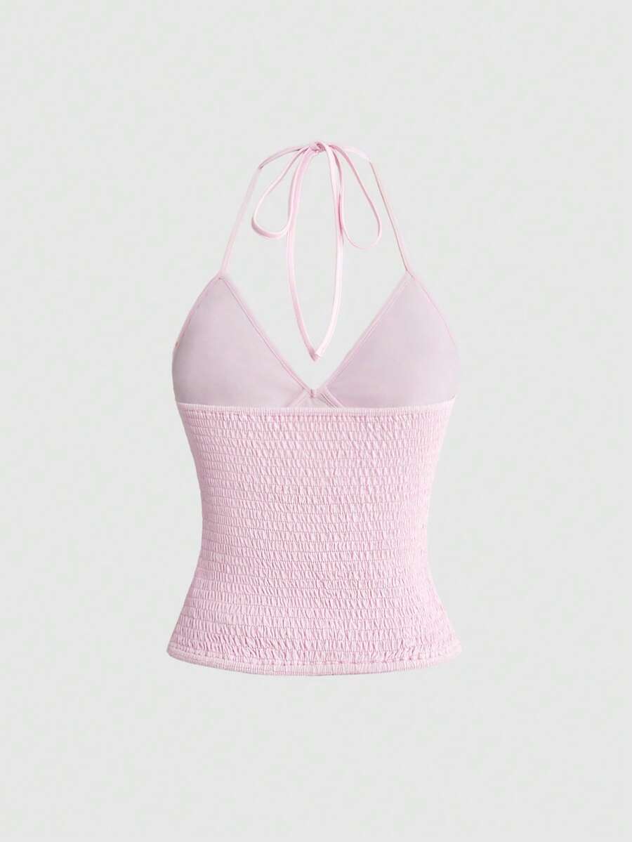 Women's floral embroidery backless halter crop top featuring contrast lace, ruched detailing, and slim fit in knitted pink fabric.