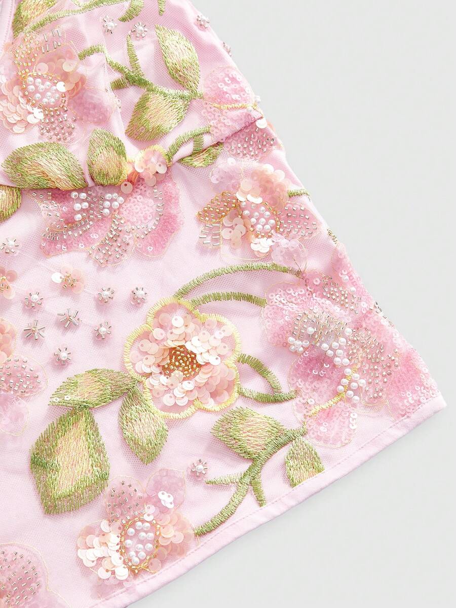 Women's floral embroidery backless halter crop top featuring contrast lace, ruched detailing, and slim fit in knitted pink fabric.