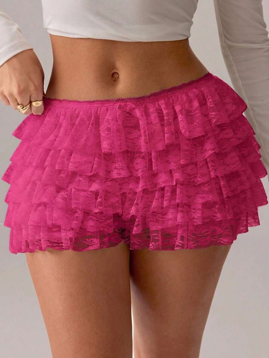 Apricot tiered lace ruffle hem low waist shorts for women featuring elastic waist and lined semi-sheer knit fabric.