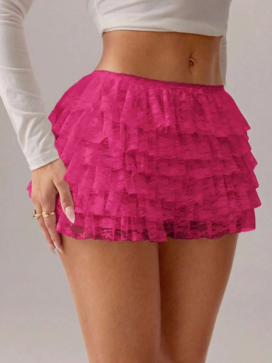 Apricot tiered lace ruffle hem low waist shorts for women featuring elastic waist and lined semi-sheer knit fabric.