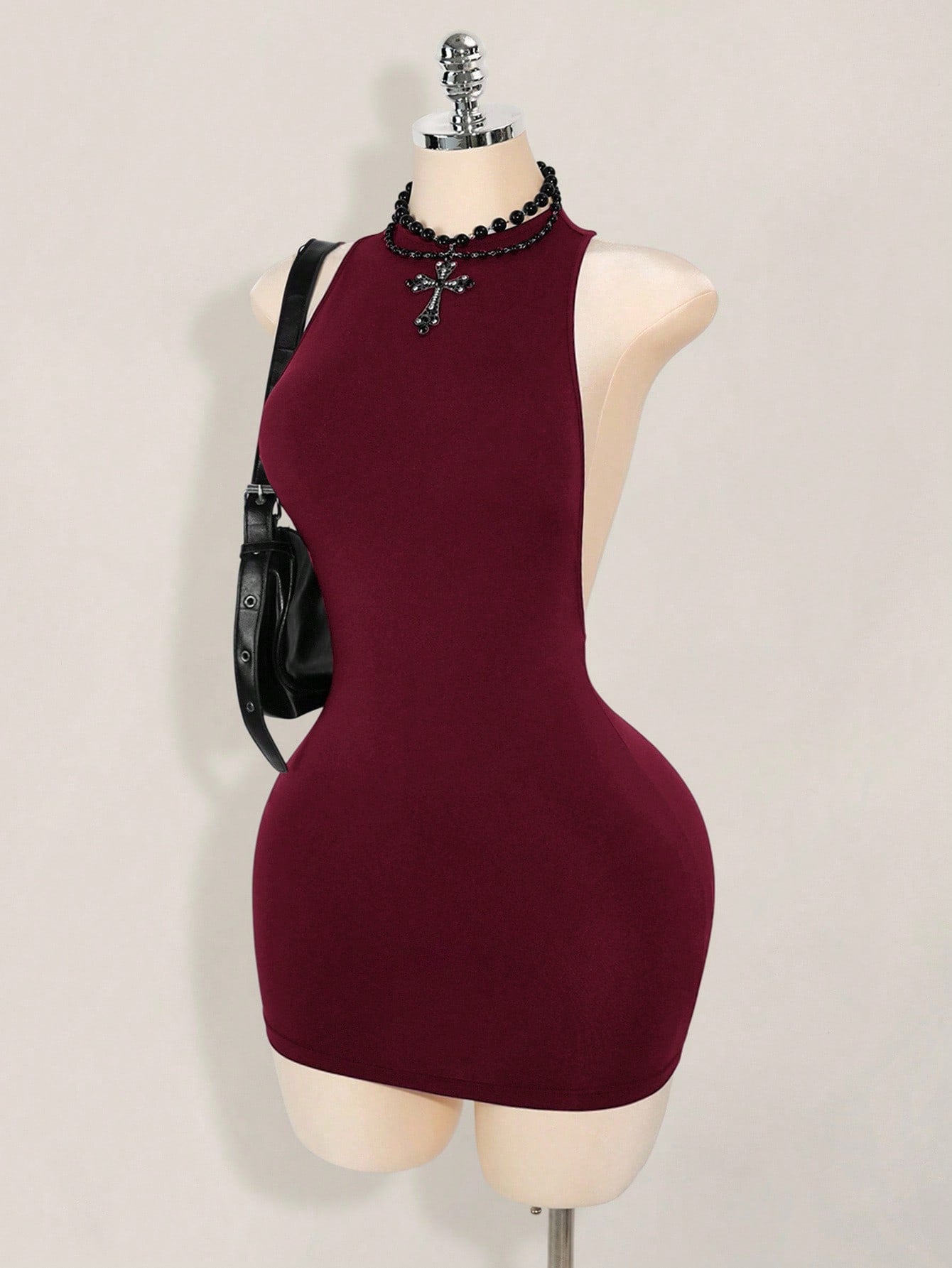 Apricot criss-cross backless bodycon mini dress for women featuring a round neck and rhinestone accent details.
