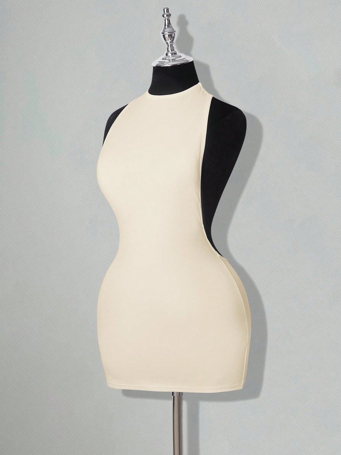 Apricot criss-cross backless bodycon mini dress for women featuring a round neck and rhinestone accent details.