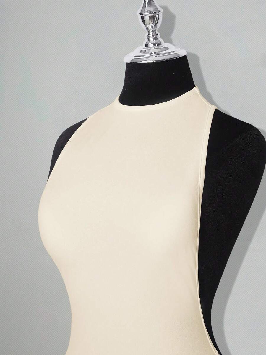 Apricot criss-cross backless bodycon mini dress for women featuring a round neck and rhinestone accent details.