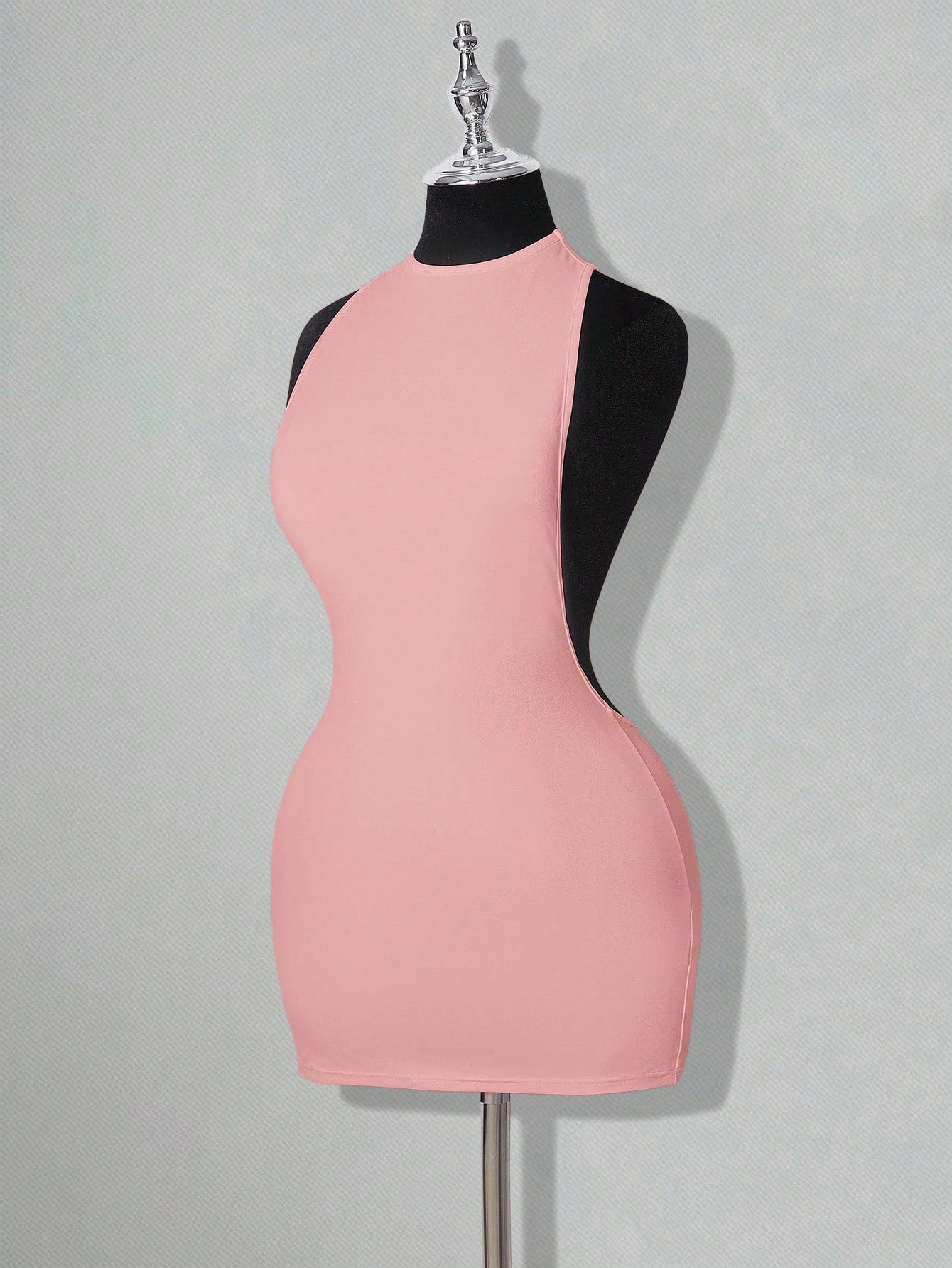 Apricot criss-cross backless bodycon mini dress for women featuring a round neck and rhinestone accent details.