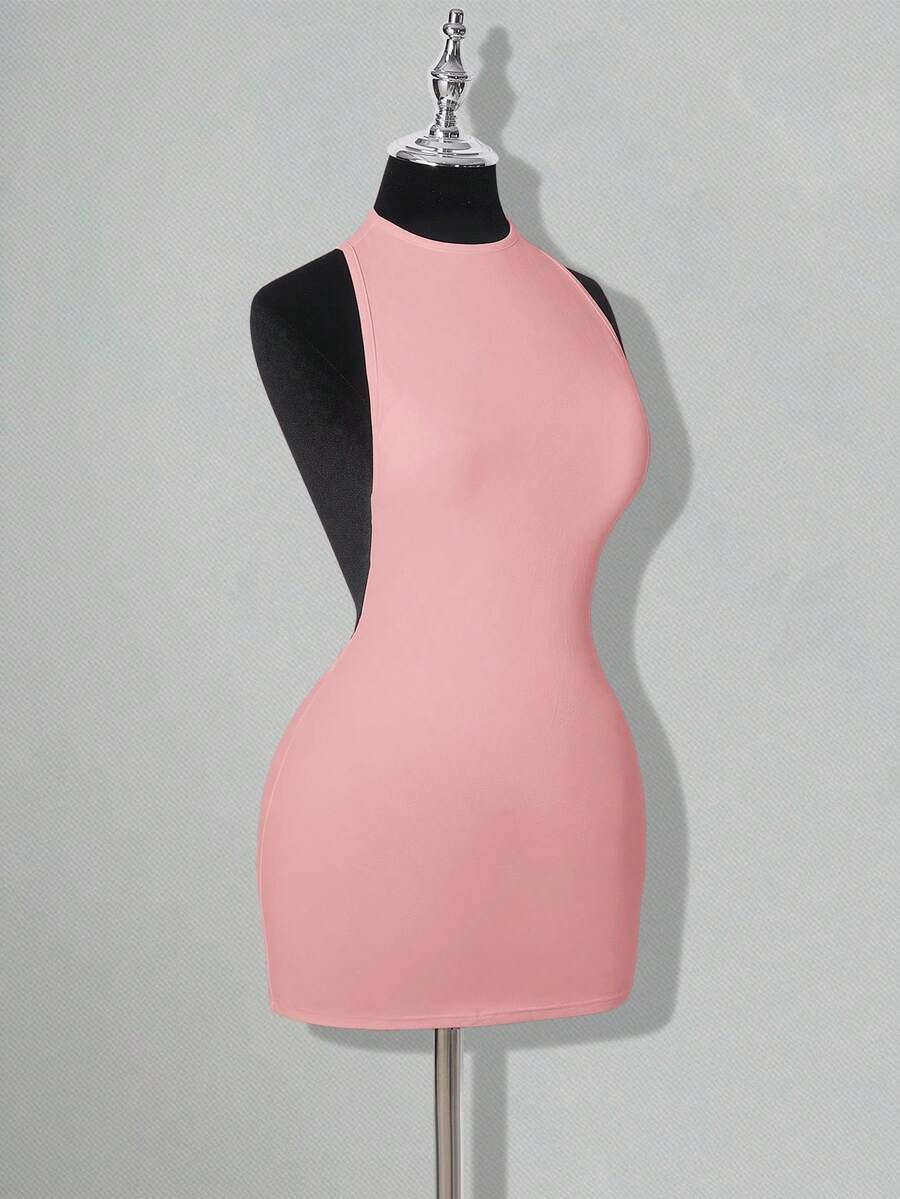 Apricot criss-cross backless bodycon mini dress for women featuring a round neck and rhinestone accent details.