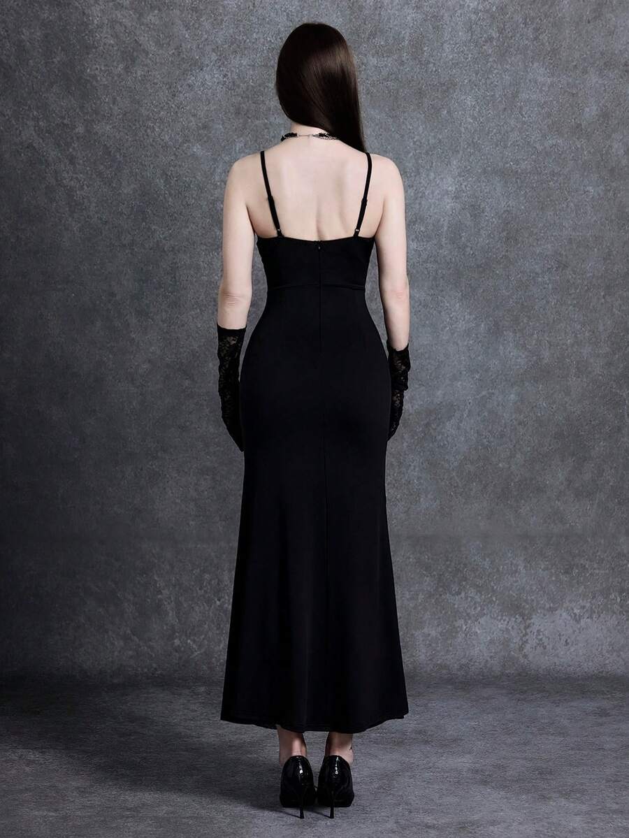 Women wearing a long black lace goth dress featuring spaghetti straps, semi-sheer fabric, and a split thigh hem.