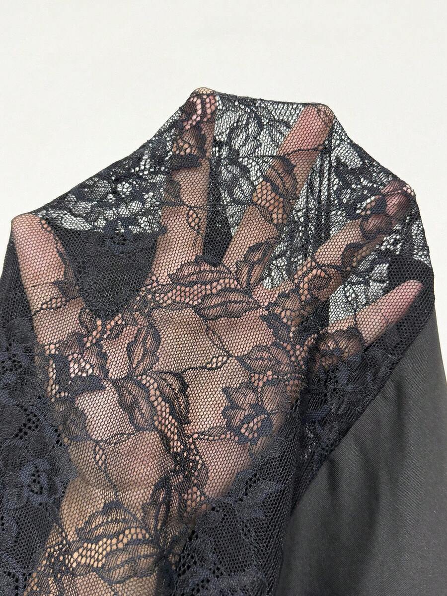 Women wearing a long black lace goth dress featuring spaghetti straps, semi-sheer fabric, and a split thigh hem.