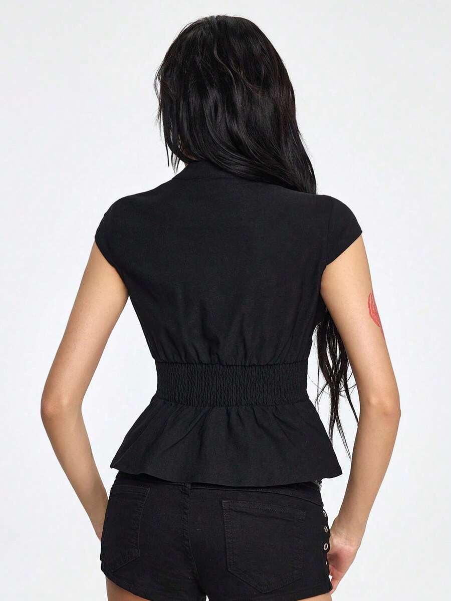 Women's black deep V-neck top featuring cap sleeves, cut-out lace-up details, zipper closure, and regular fit woven fabric.