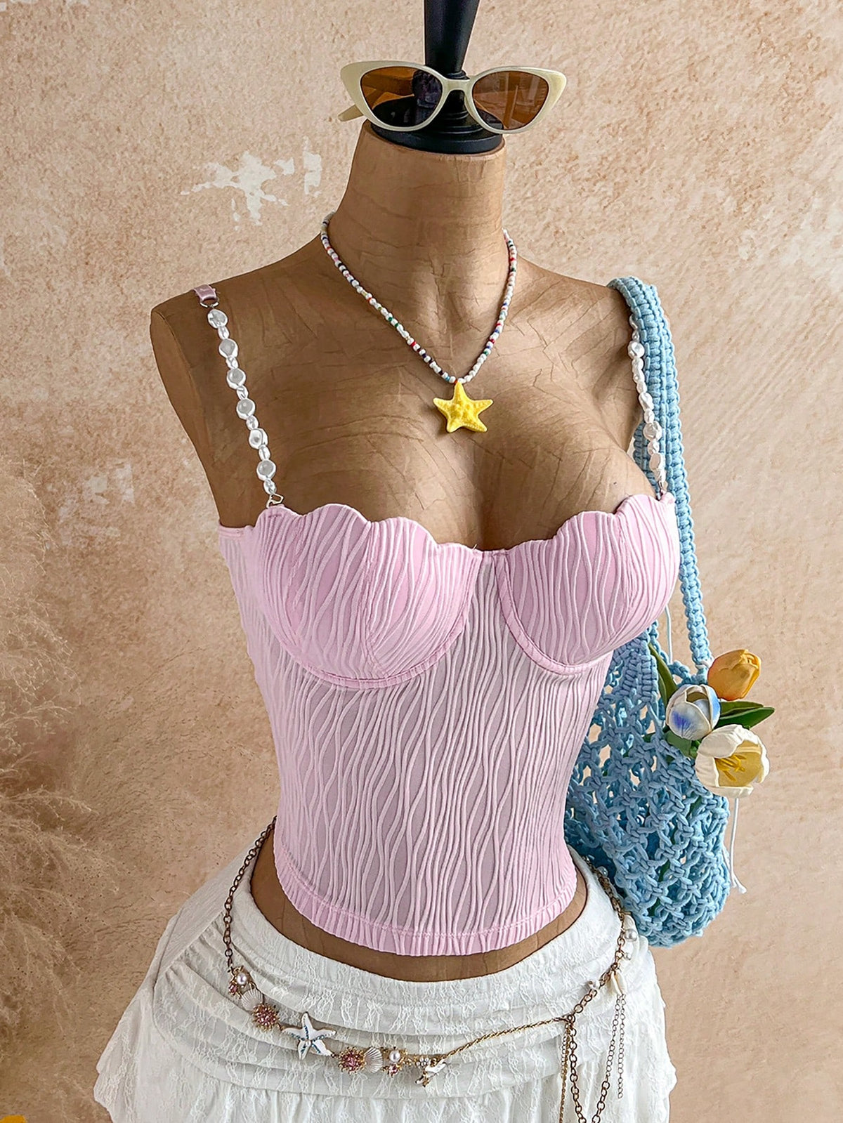 Women's black molded cup camisole top with scallop detailing and spaghetti straps.