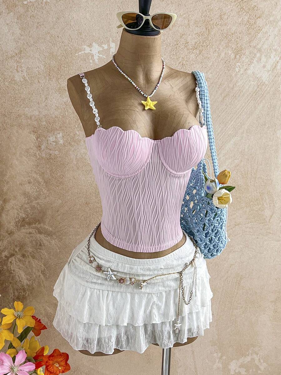 Women's black molded cup camisole top with scallop detailing and spaghetti straps.