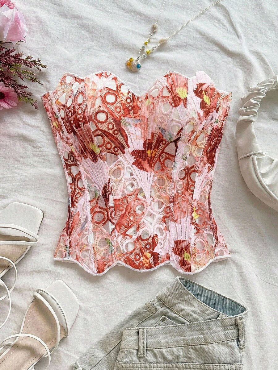 Strapless floral corset top with lace-up detail, asymmetrical hem, and slim fit for women in a boho vacation style.