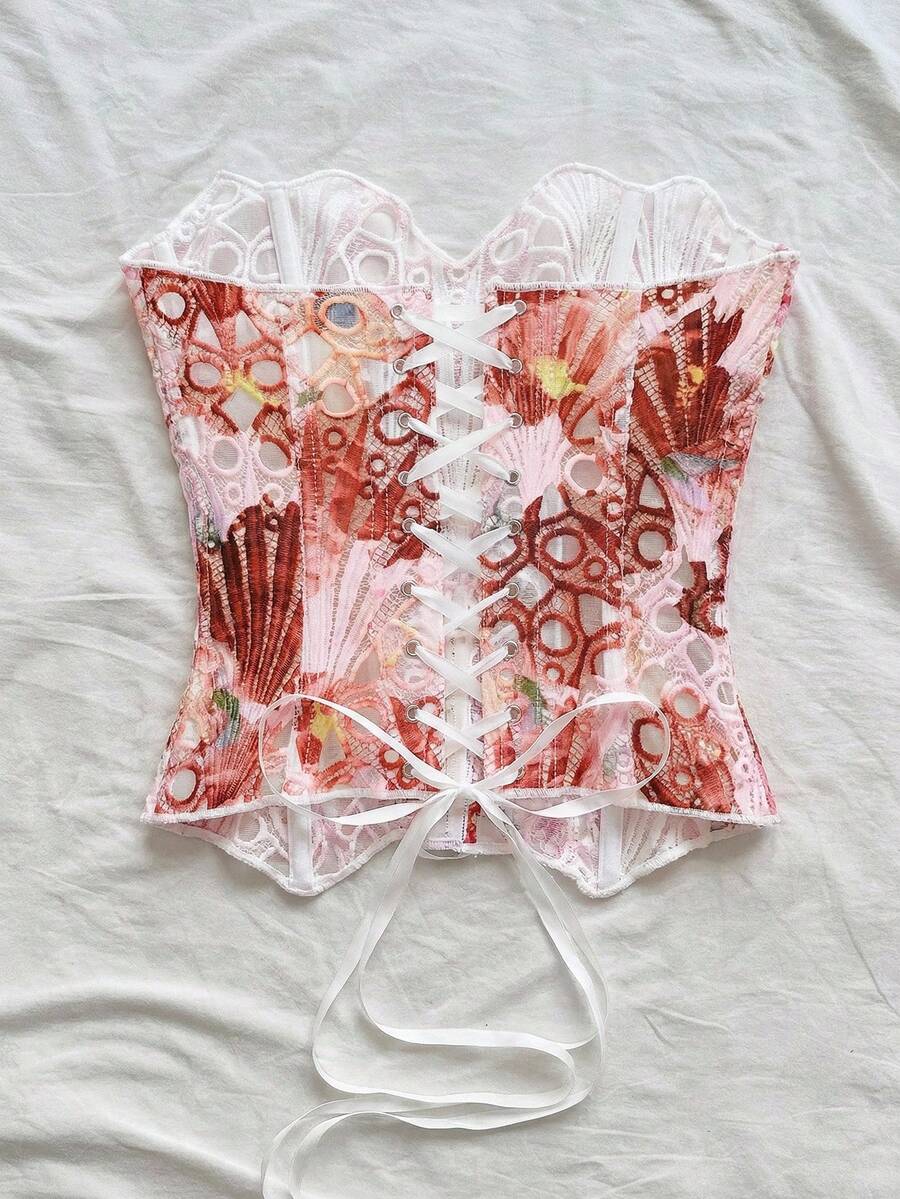 Strapless floral corset top with lace-up detail, asymmetrical hem, and slim fit for women in a boho vacation style.