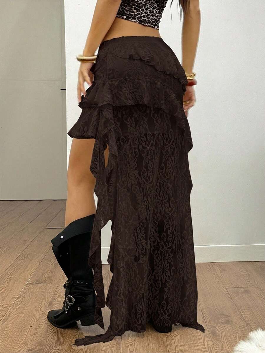 Women's black asymmetrical long skirt with ruffle hem and low waist design in knitted fabric.