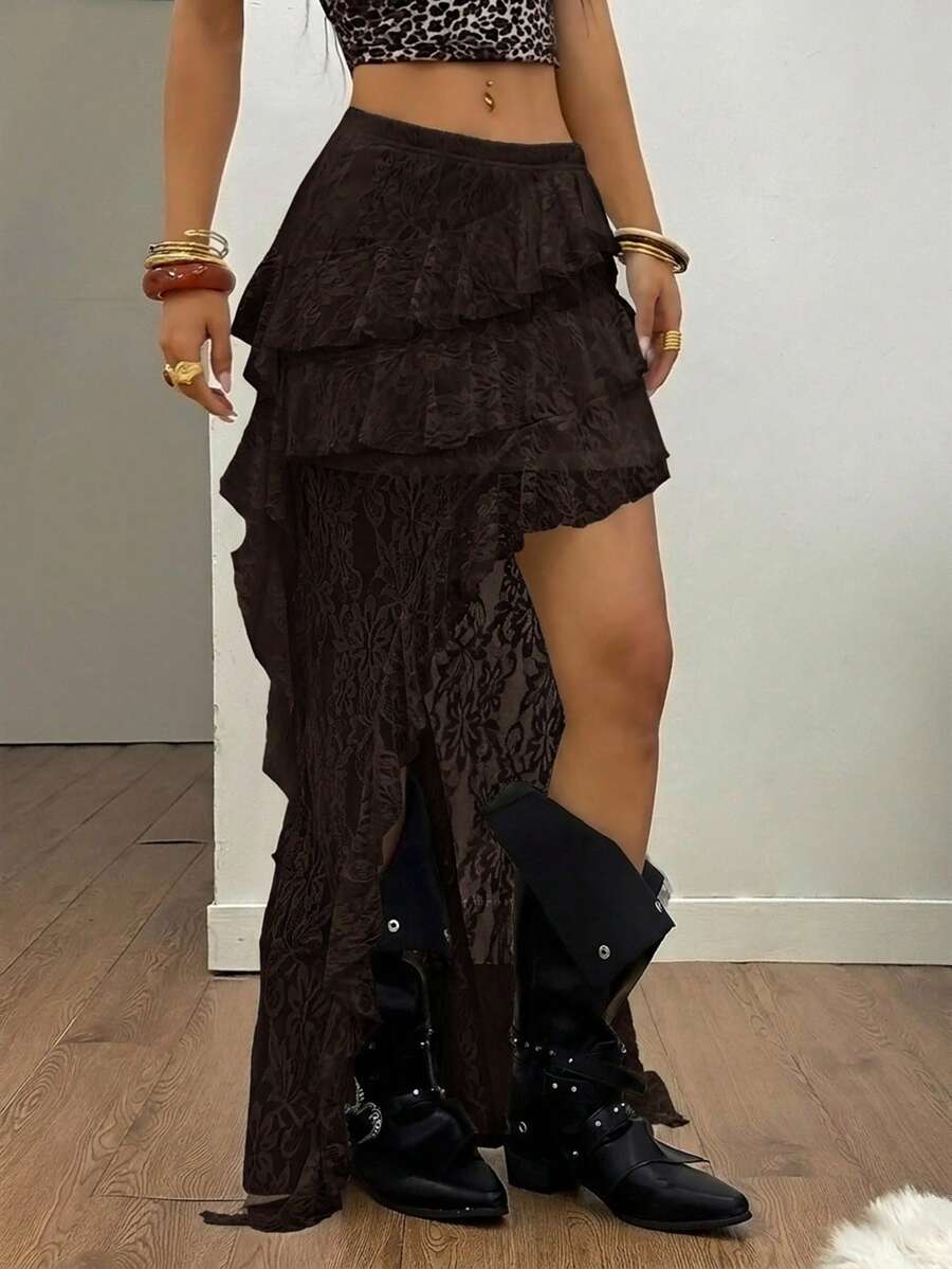 Women's black asymmetrical long skirt with ruffle hem and low waist design in knitted fabric.