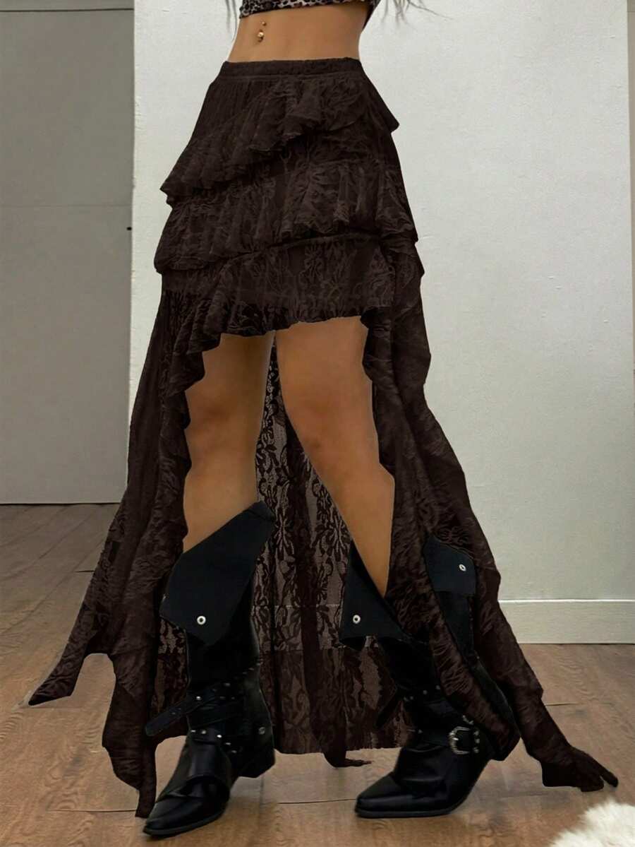 Women's black asymmetrical long skirt with ruffle hem and low waist design in knitted fabric.