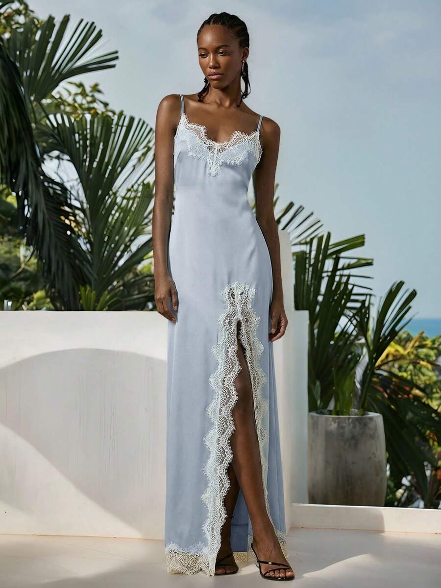 Women's black lace split satin long dress featuring spaghetti straps, asymmetrical slit hem, and matching arm sleeves.