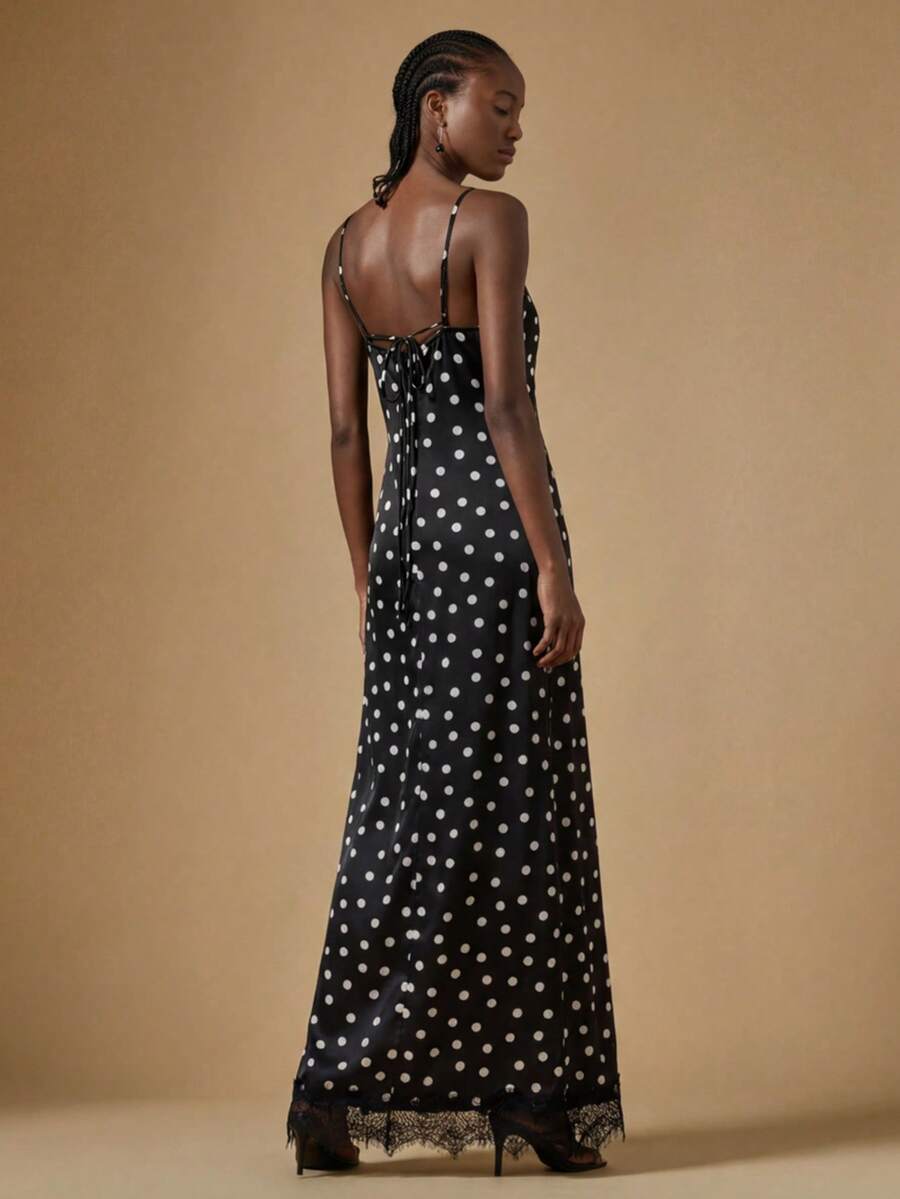 Women's black lace split satin long dress featuring spaghetti straps, asymmetrical slit hem, and matching arm sleeves.