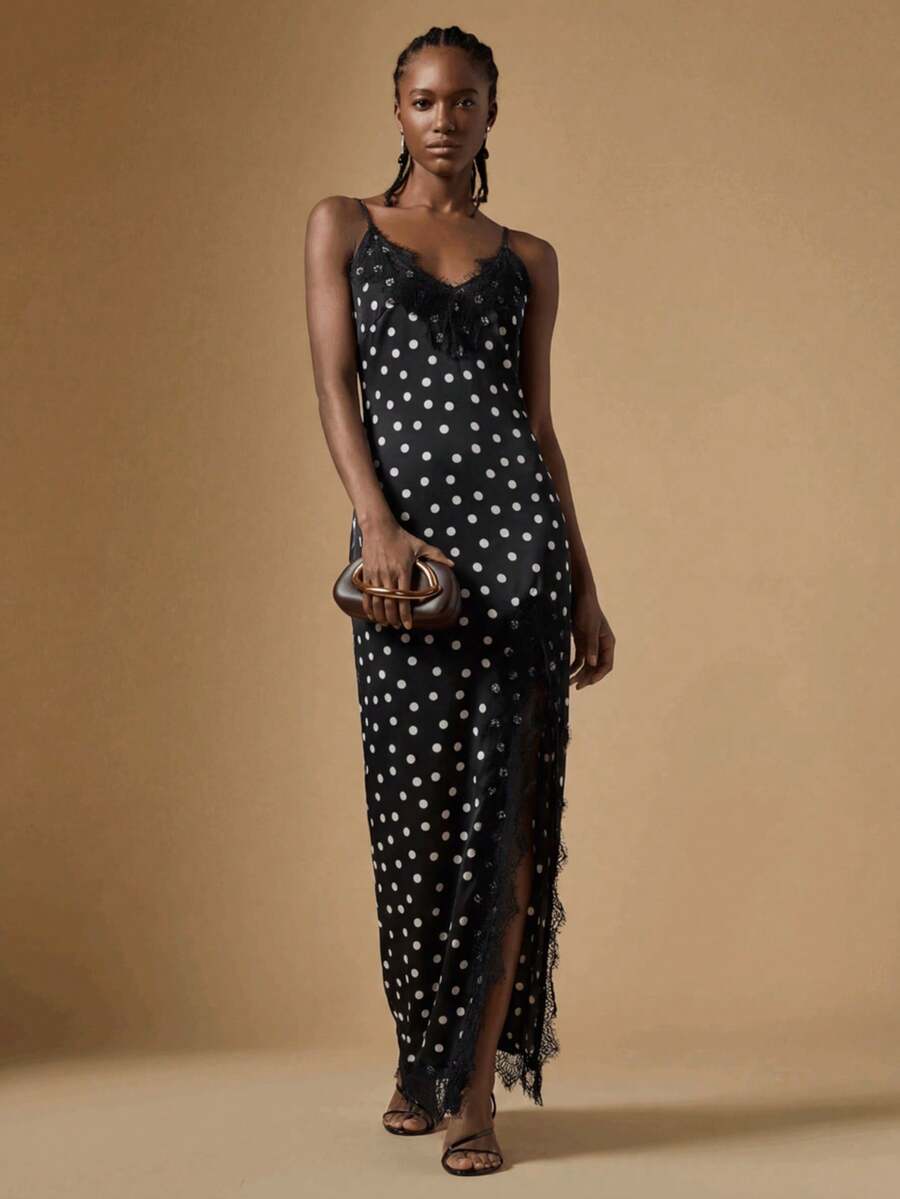 Women's black lace split satin long dress featuring spaghetti straps, asymmetrical slit hem, and matching arm sleeves.