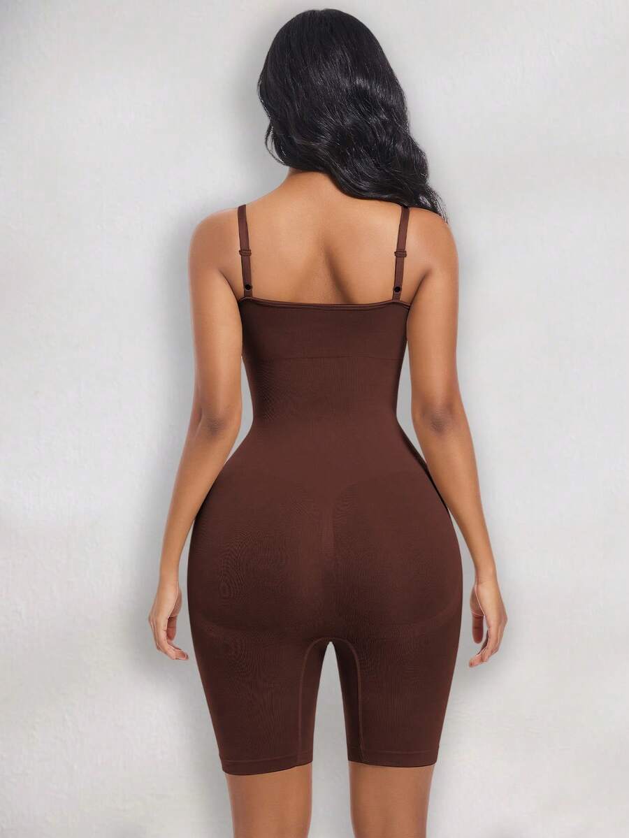Women's black seamless shapewear jumpsuit with spaghetti straps, backless design, and strong tummy control full body shaping.