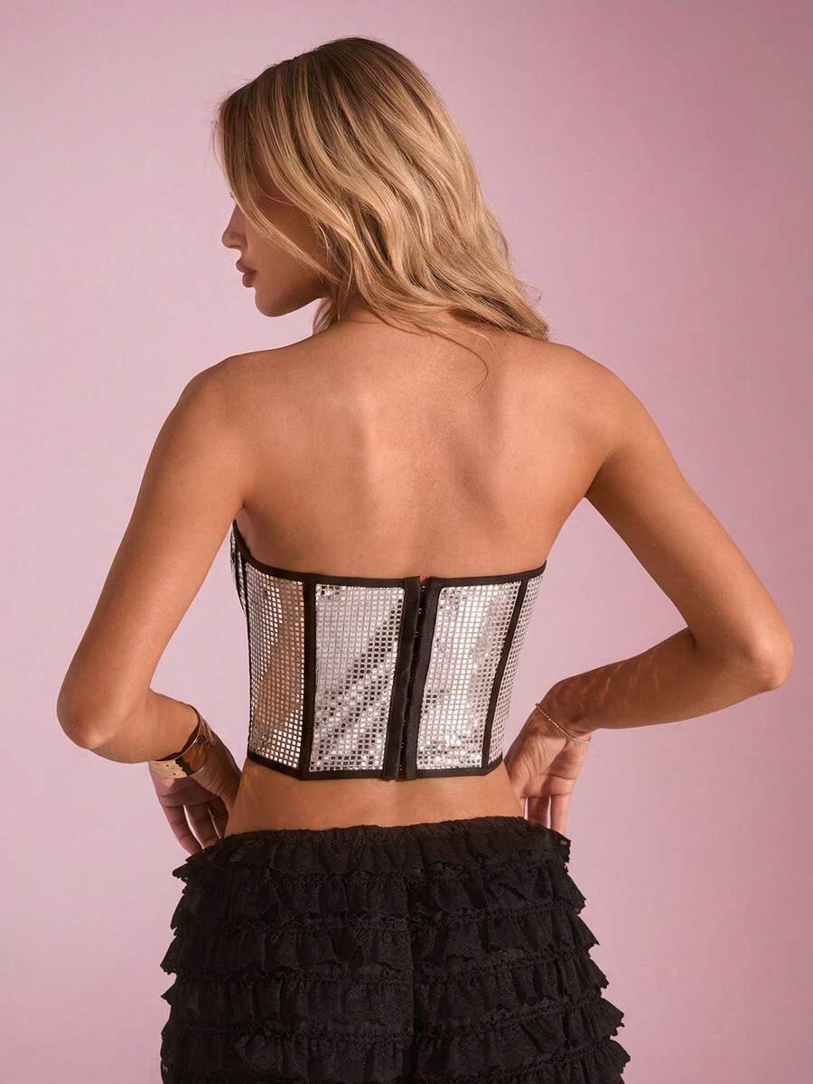 Women's metallic corset crop top in apricot featuring a sweetheart neckline, asymmetrical hem, backless cut, and matching arm sleeves.