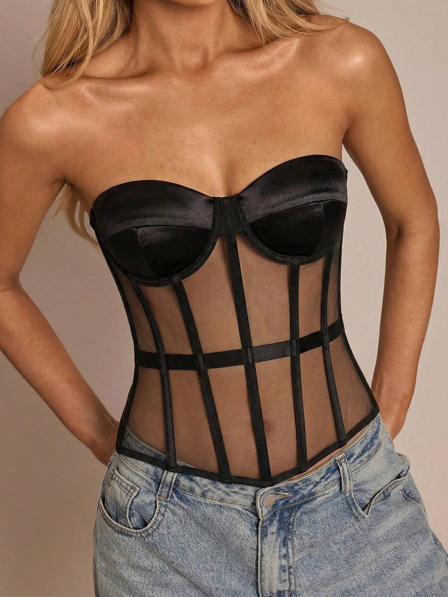 Women's black mesh patchwork bustier corset crop top with sweetheart neckline and asymmetrical hem.