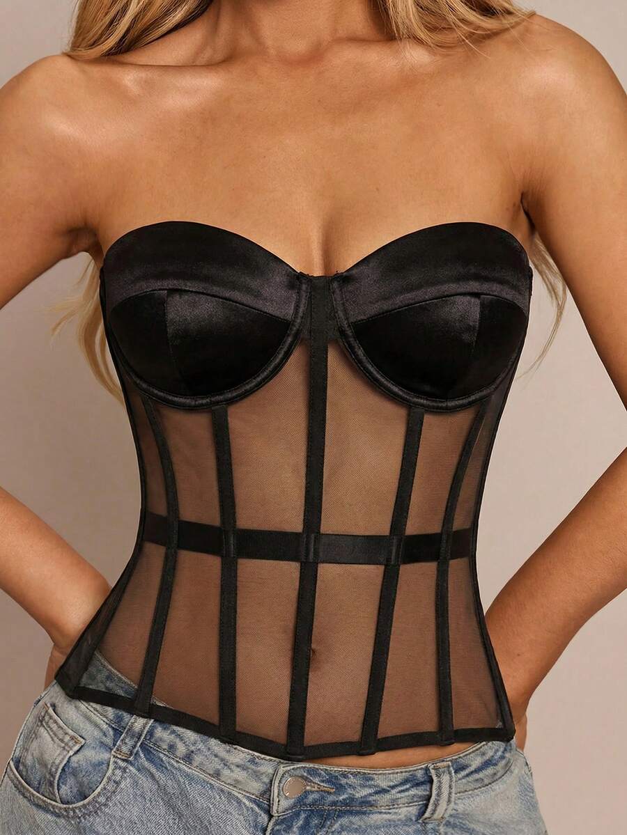 Women's black mesh patchwork bustier corset crop top with sweetheart neckline and asymmetrical hem.