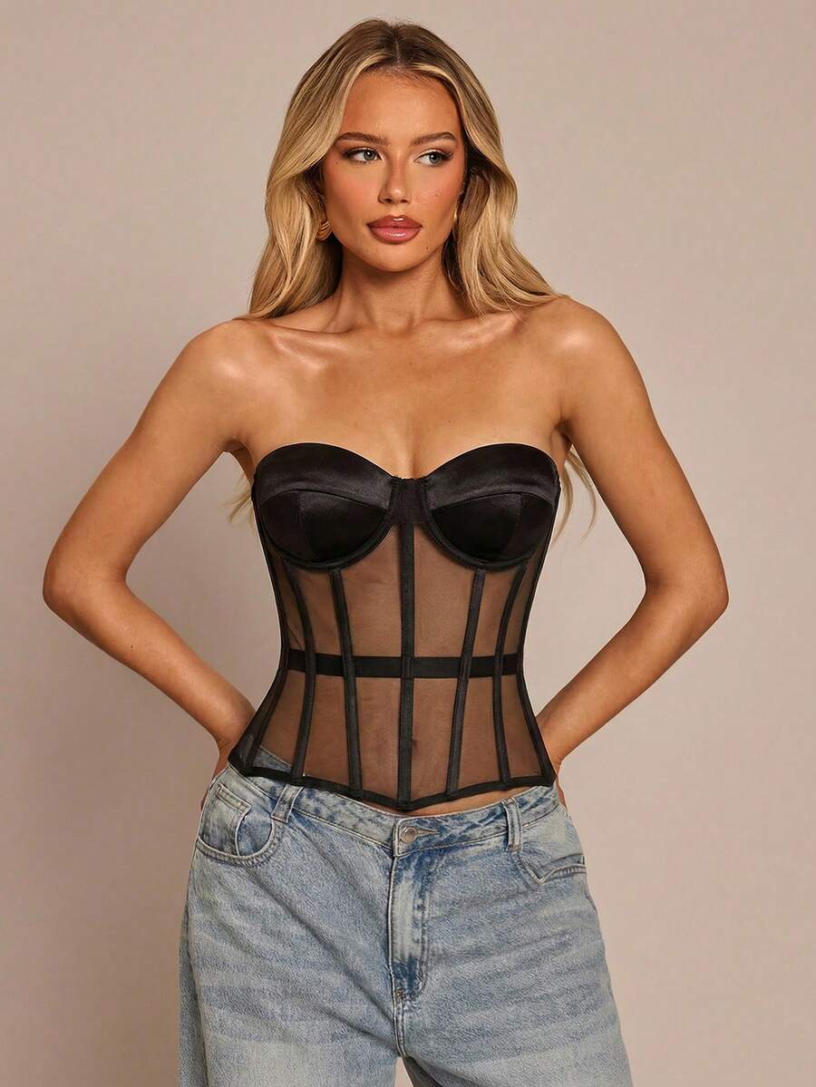 Women's black mesh patchwork bustier corset crop top with sweetheart neckline and asymmetrical hem.
