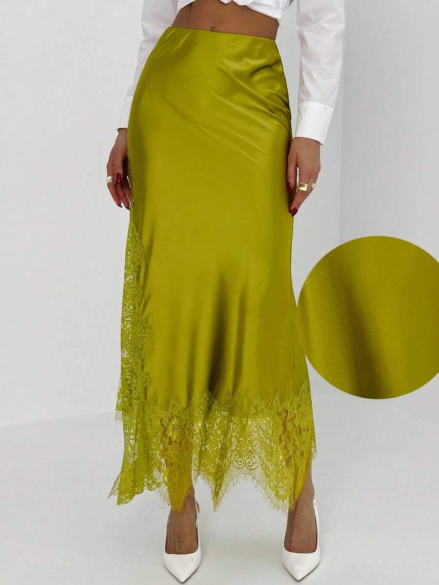 Women's elegant black lace patchwork mermaid maxi skirt featuring asymmetrical contrast lace design and low waist fit.
