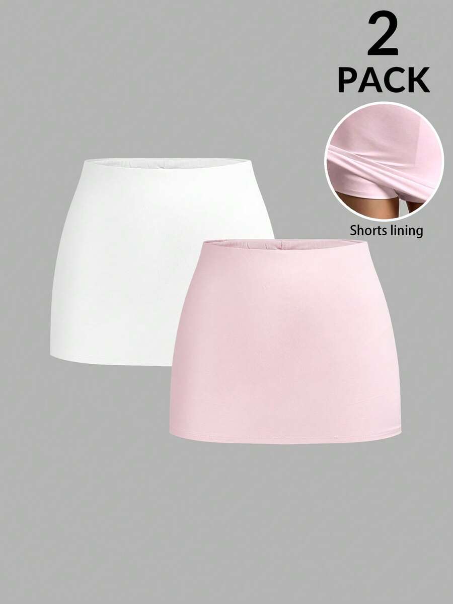 Women's black casual low rise bodycon mini skort with built-in shorts in knitted plain stretch fabric.