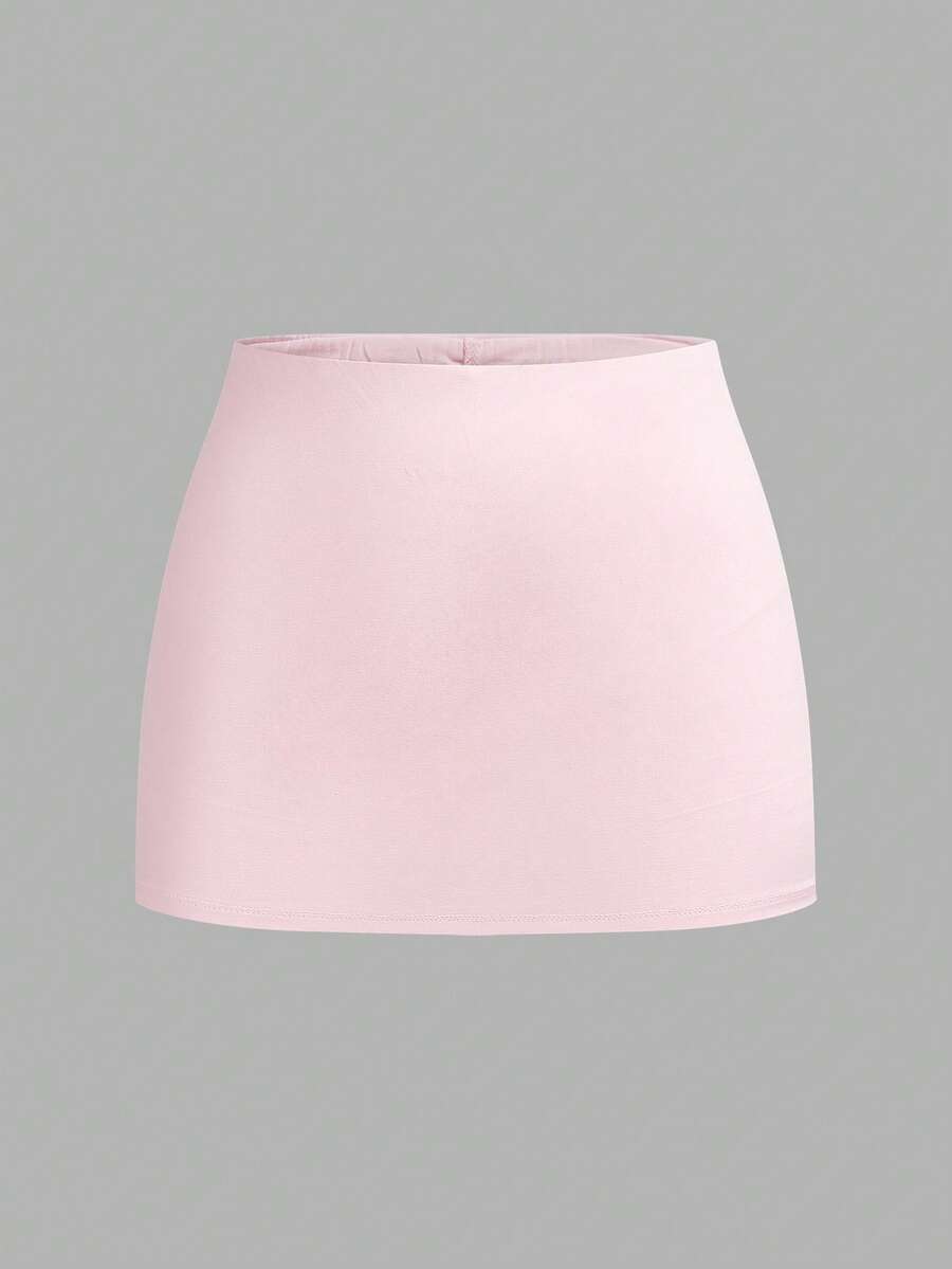 Women's black casual low rise bodycon mini skort with built-in shorts in knitted plain stretch fabric.