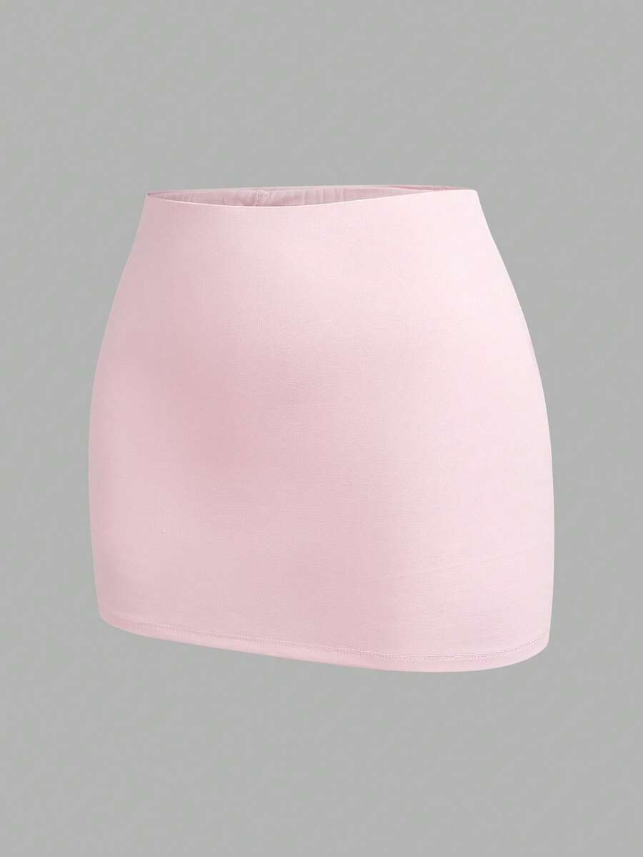 Women's black casual low rise bodycon mini skort with built-in shorts in knitted plain stretch fabric.