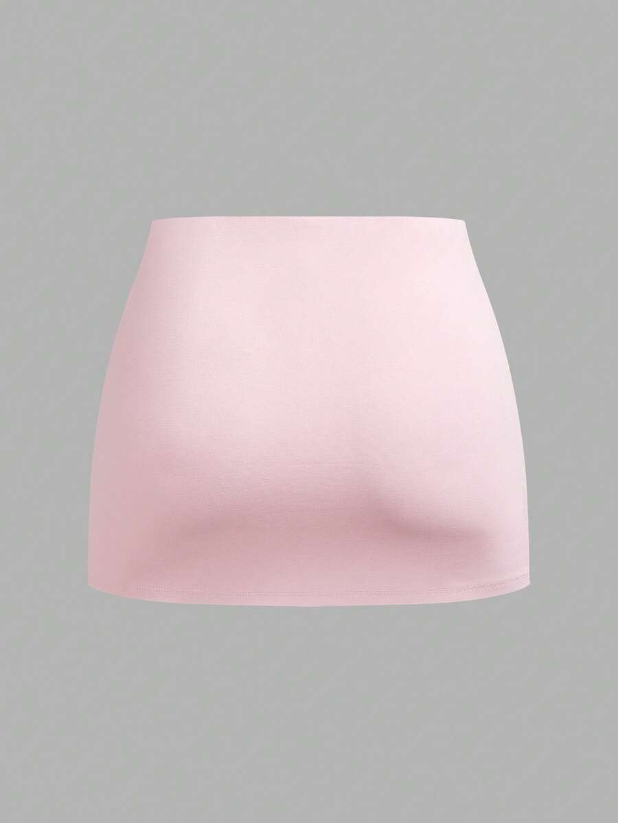 Women's black casual low rise bodycon mini skort with built-in shorts in knitted plain stretch fabric.