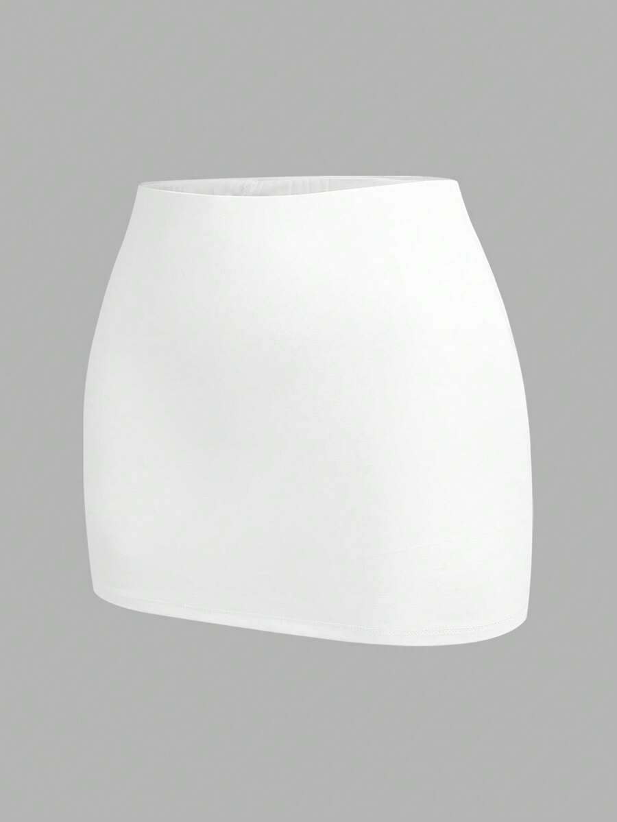 Women's black casual low rise bodycon mini skort with built-in shorts in knitted plain stretch fabric.