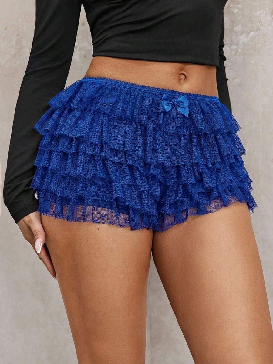 Apricot tiered lace ruffle hem low waist shorts for women featuring elastic waist and lined semi-sheer knit fabric.