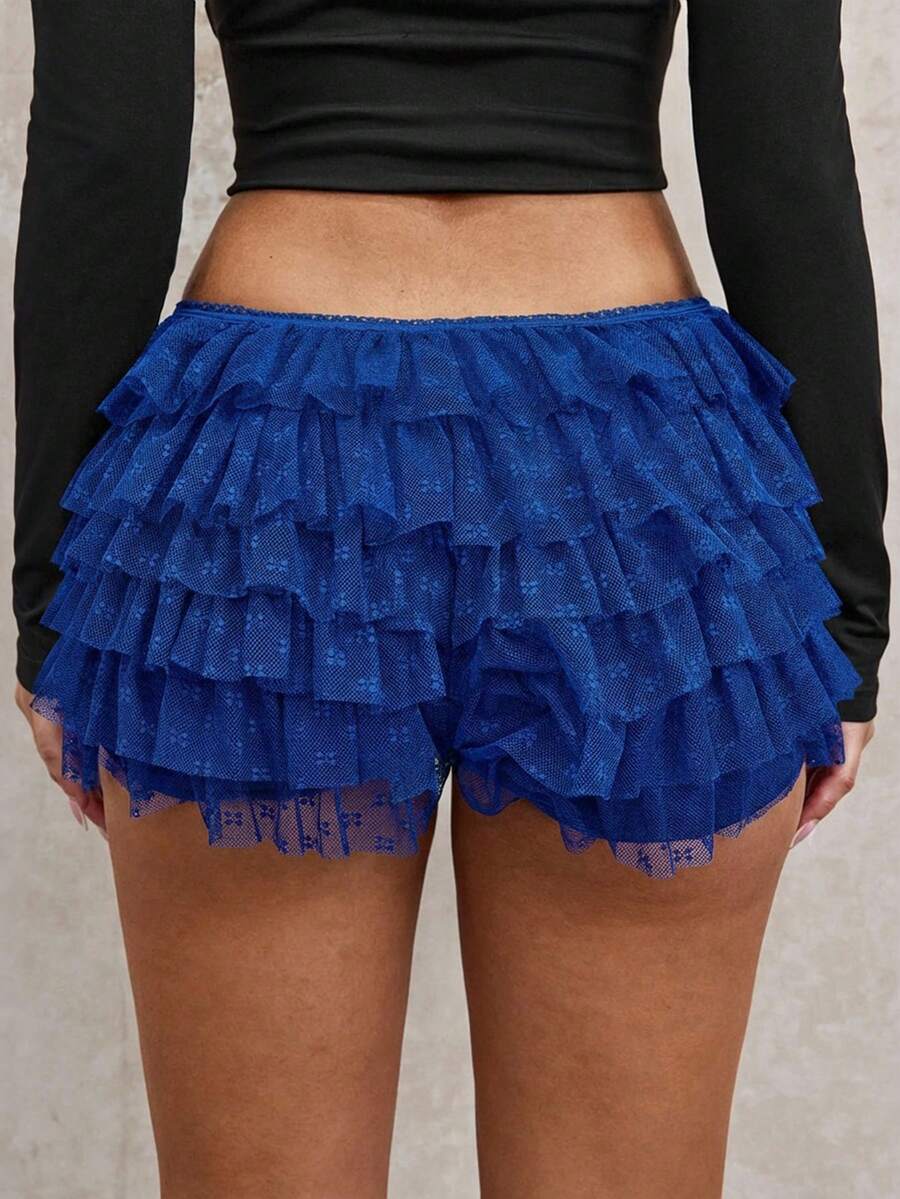 Apricot tiered lace ruffle hem low waist shorts for women featuring elastic waist and lined semi-sheer knit fabric.