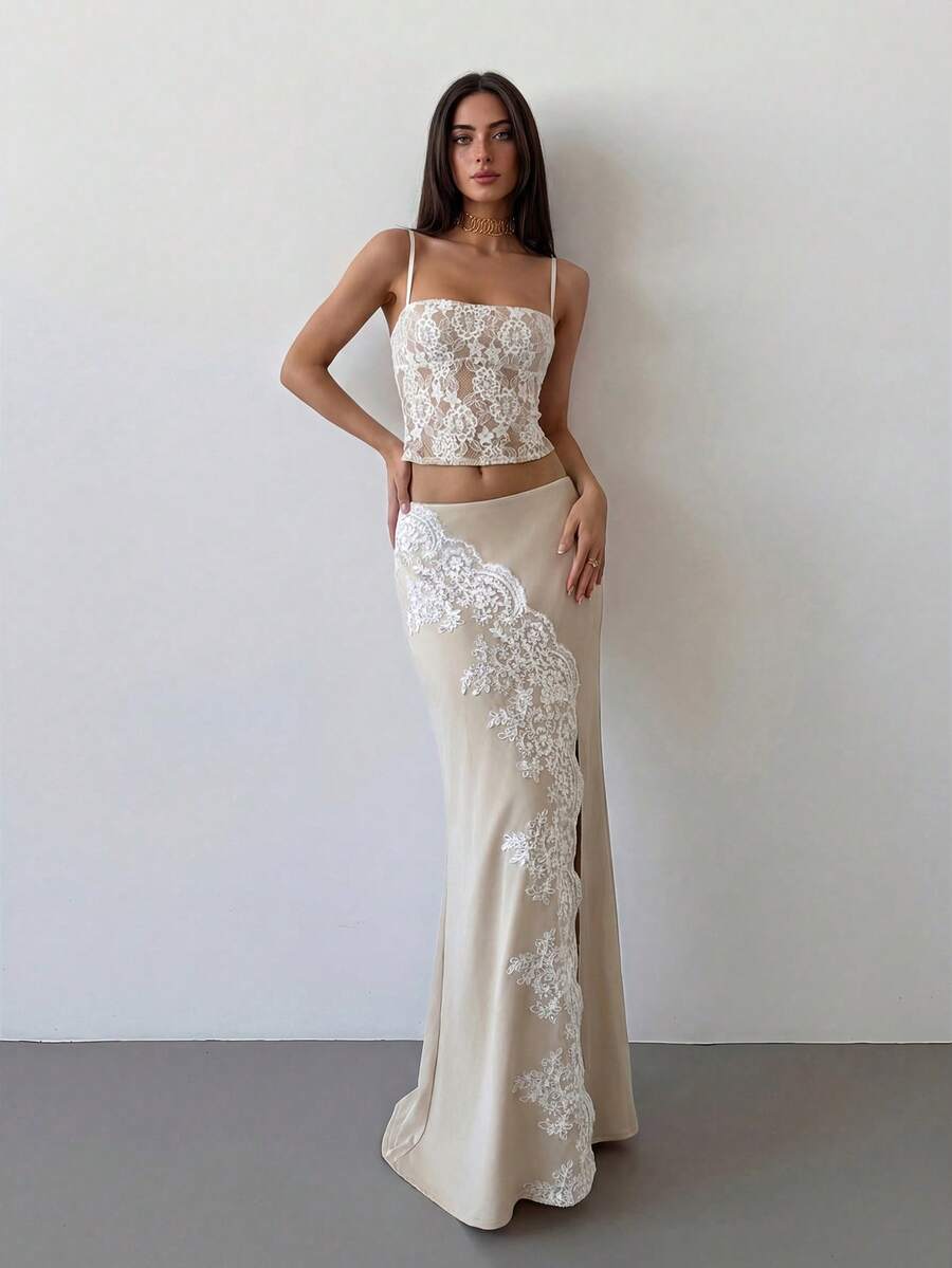 Women's apricot satin fishtail maxi skirt featuring a low waist, slit detail, lined body, and zipper closure.