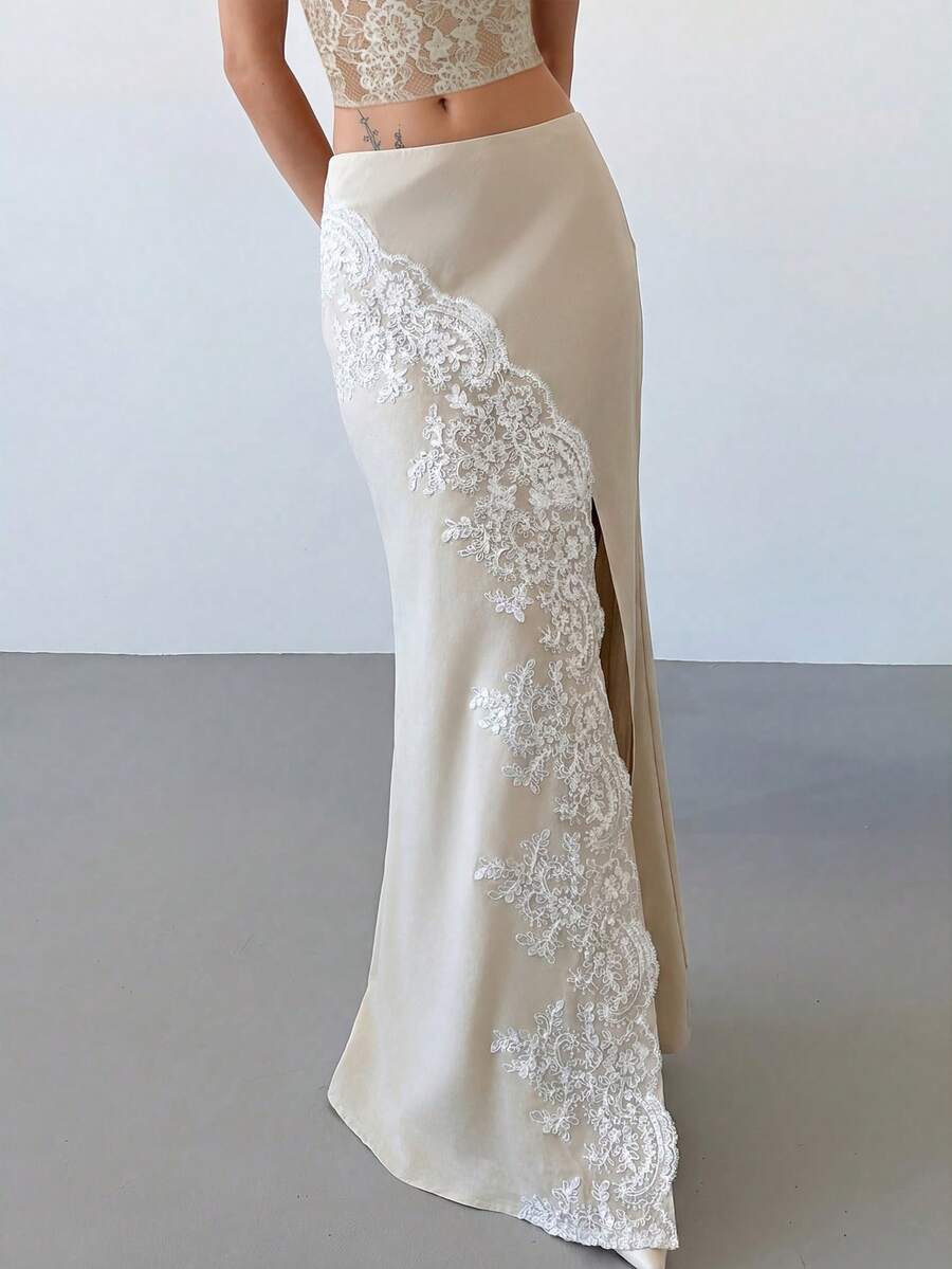 Women's apricot satin fishtail maxi skirt featuring a low waist, slit detail, lined body, and zipper closure.