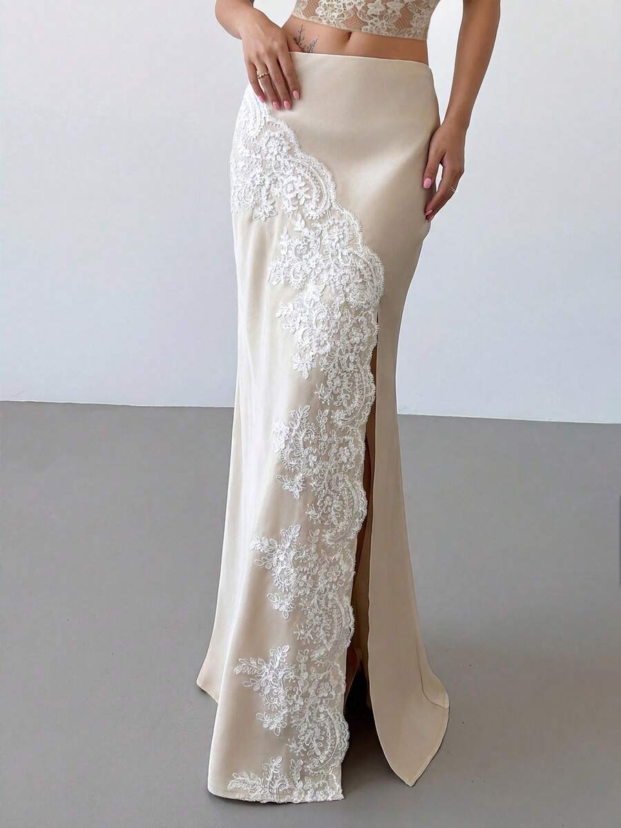 Women's apricot satin fishtail maxi skirt featuring a low waist, slit detail, lined body, and zipper closure.