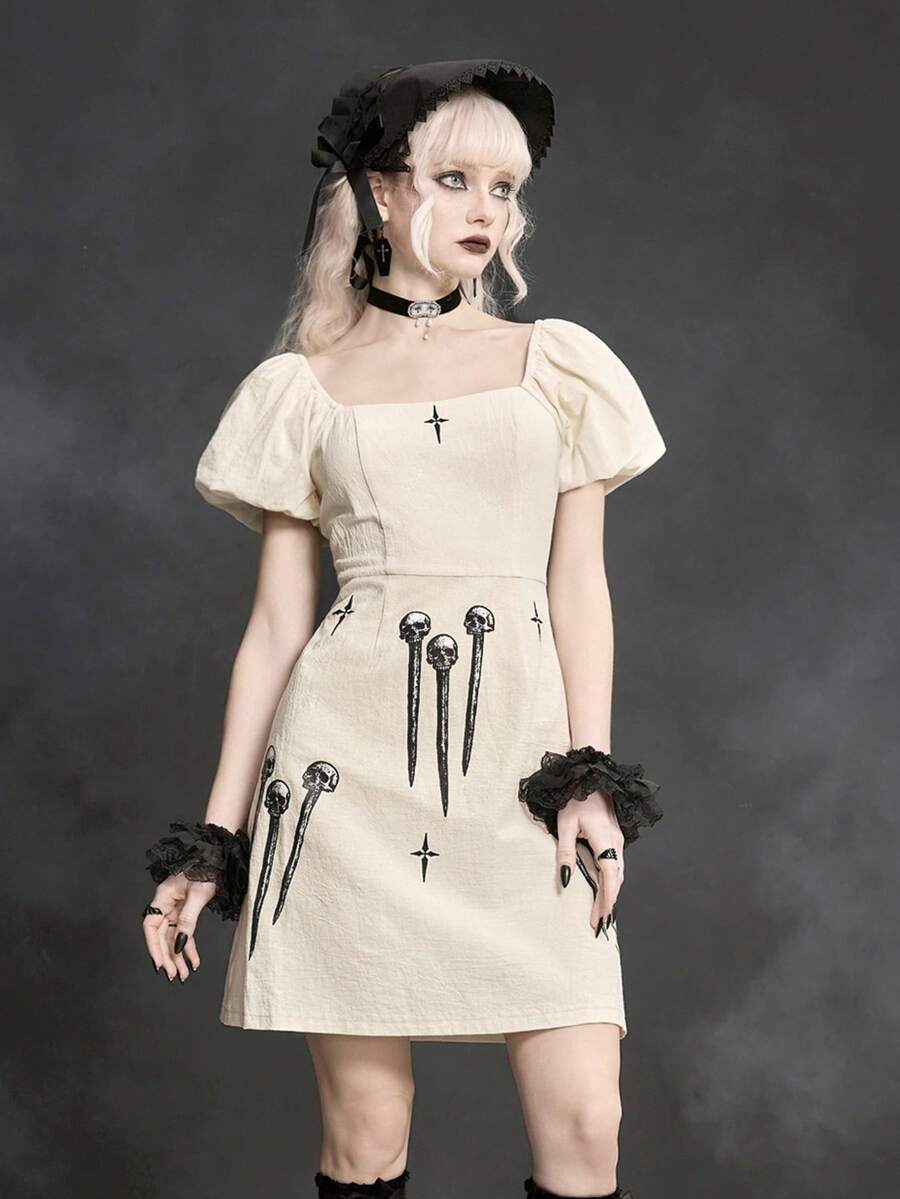 White Goth mini skater dress for women featuring dark skull graphic print, square neckline, short puff sleeves, and lace-up detail.