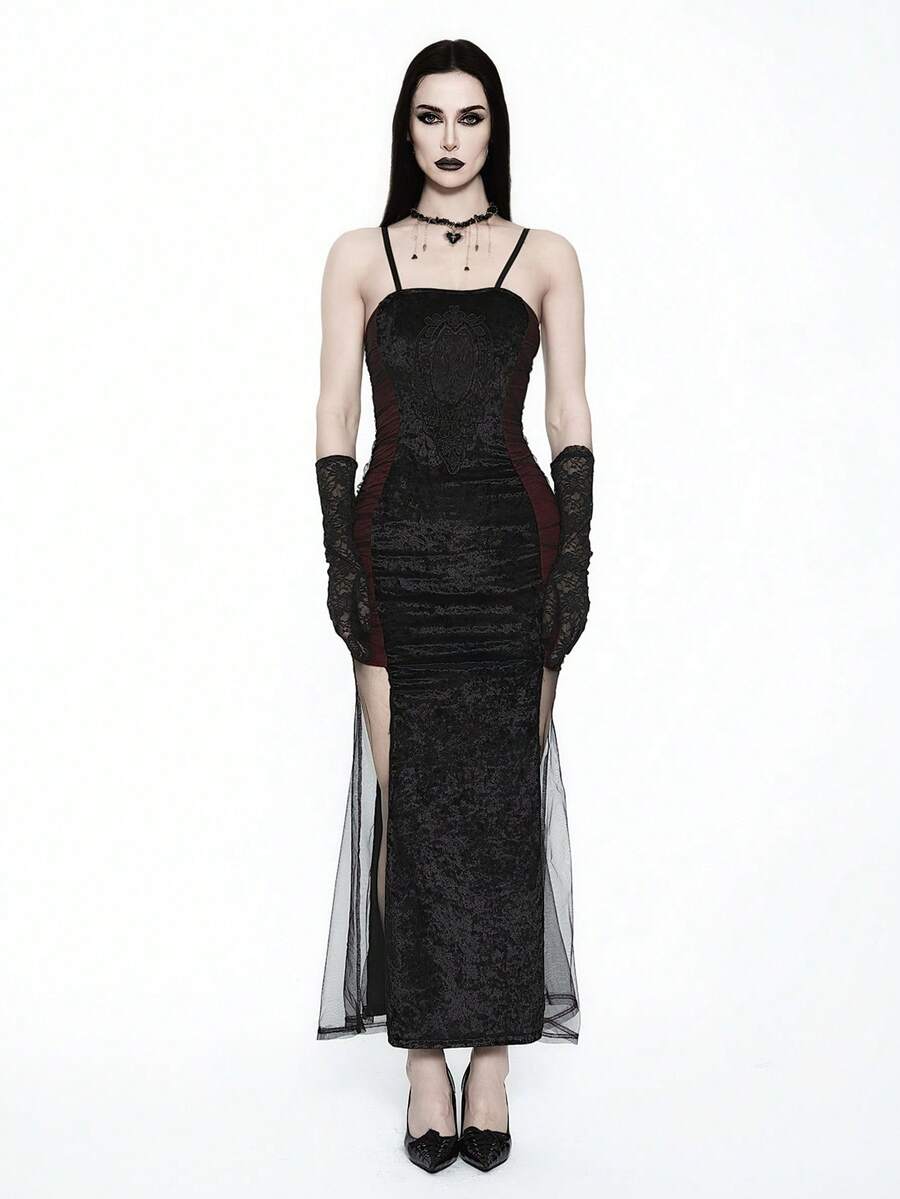 Women wearing an elegant black backless midi cami dress with slender spaghetti straps and a side split thigh hem.