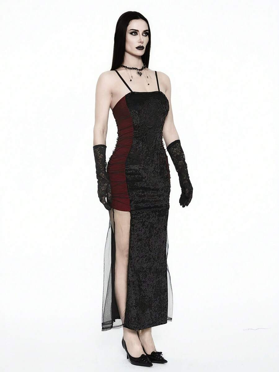 Women wearing an elegant black backless midi cami dress with slender spaghetti straps and a side split thigh hem.