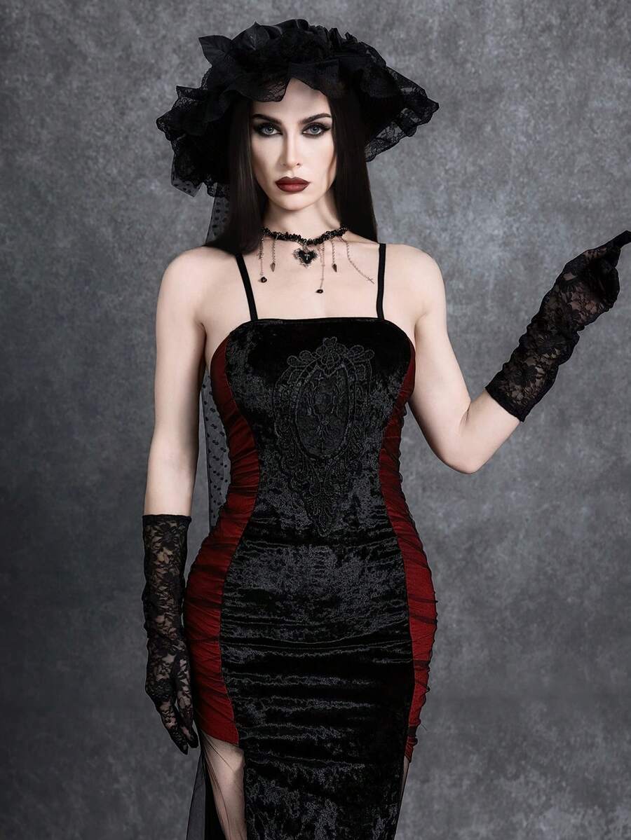 Women wearing an elegant black backless midi cami dress with slender spaghetti straps and a side split thigh hem.