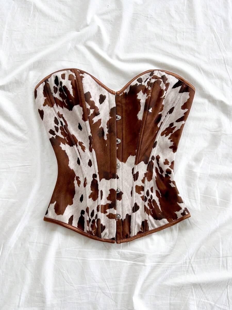 Strapless black lace-up corset top for women with grommet eyelet details, slim fit, lined body, and woven fabric construction.