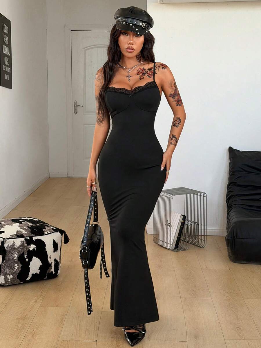 Black backless cami midi dress for women featuring spaghetti straps, slim fit mermaid silhouette, backless button detail, and high stretch knitted fabric.