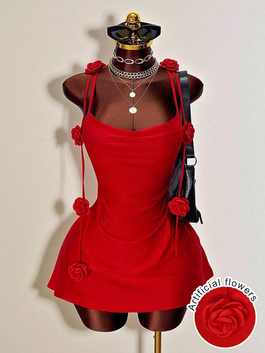 Women's bodycon mini dress featuring a 3D rose accent, thin spaghetti straps, and an open back design.