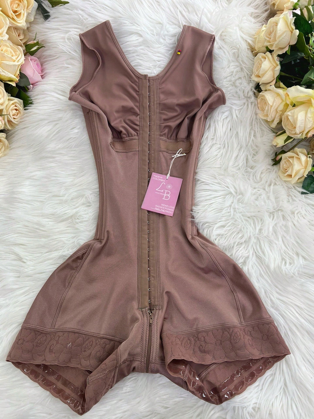 Apricot tummy control shapewear bodysuit for women featuring contrast mesh details, front zipper, and strong support knitwear material.