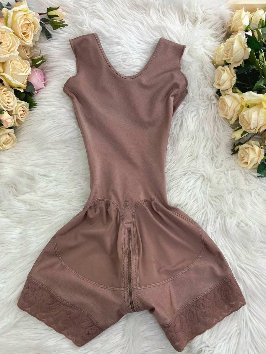 Apricot tummy control shapewear bodysuit for women featuring contrast mesh details, front zipper, and strong support knitwear material.